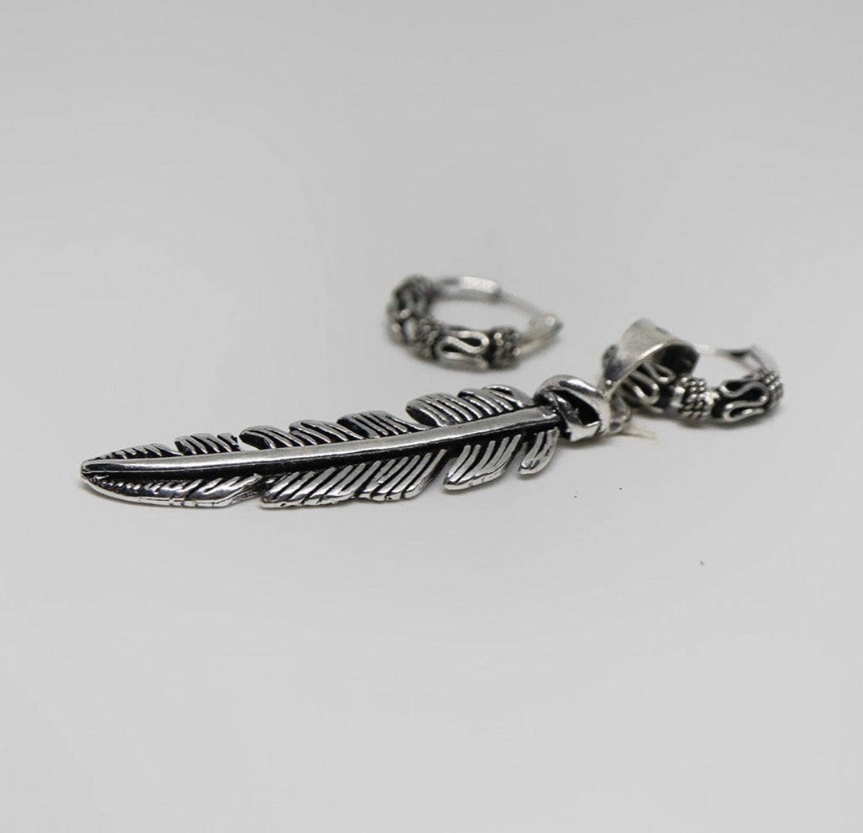 Feather silver earring