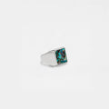 Silver ring with an abalone shell stone on a white background