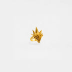 Gold ring with an agave design on a white background