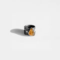 Silver ring with a amber gemstone on a white background