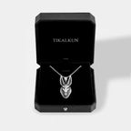 Silver necklace with anubis pendant in a black Tikalkun box on a white background
