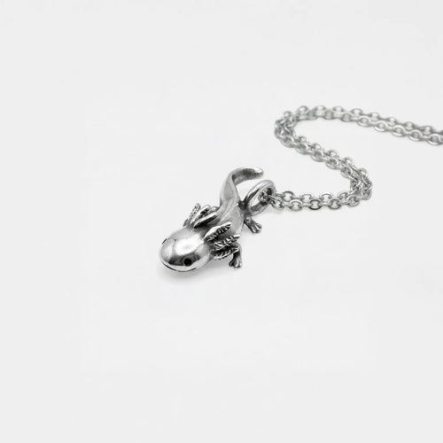 Silver axolotlpendant on a chain against a white background