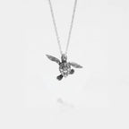 baby turtle silver pendant on a white background