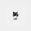 Silver ring with a bear head design on a white background