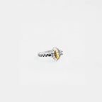 Silver bee ring with a gold bee design on a white background