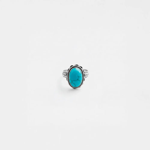 Ring with a turquoise stone on a white background
