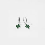 Pair of green cactus earrings on a white background