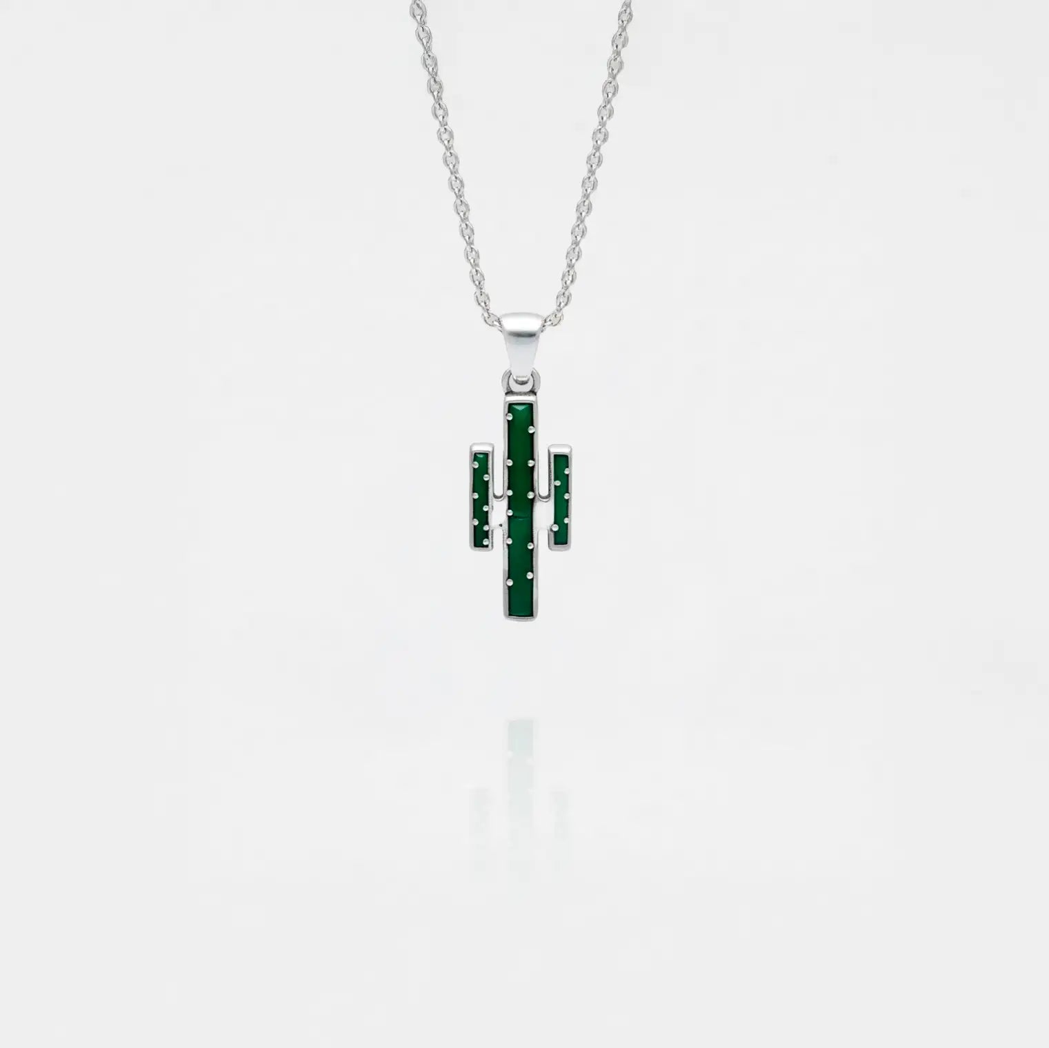 Silver necklace with a cactus pendant on a white background