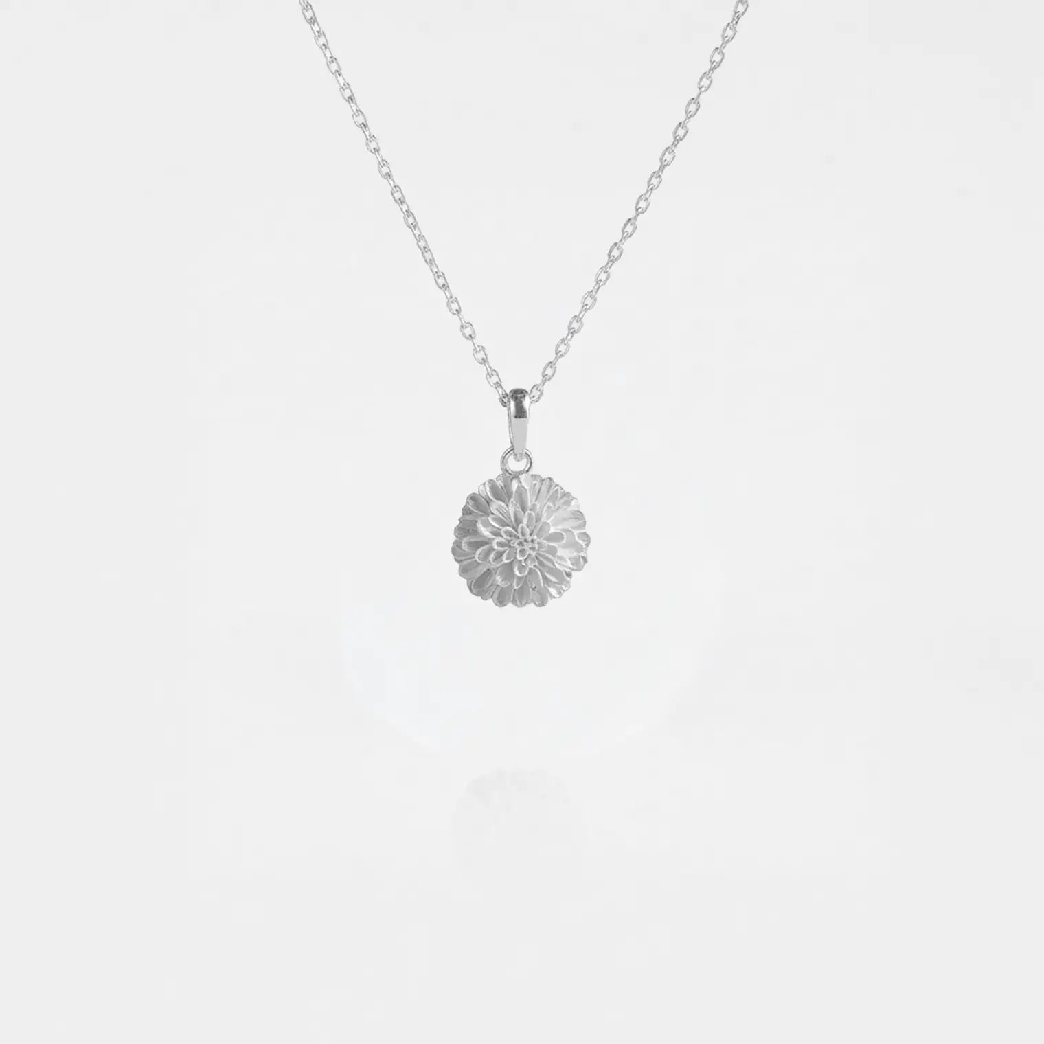 Marigold flower silver necklace on a white background