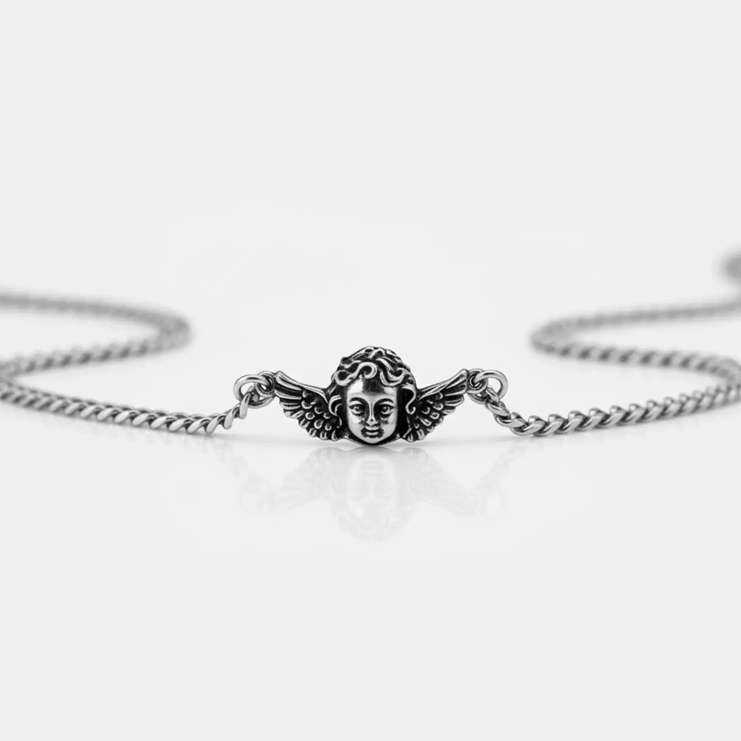 cherub silver necklace on a white background