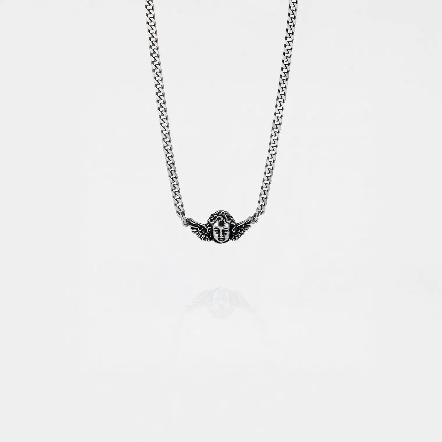 cherub silver necklace on a white background