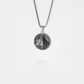 Silver necklace with a pyramid pendant on a white background