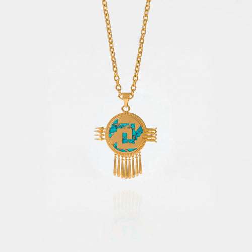 aztec shield Gold necklace with a circular pendant featuring turquoise stones on a white background
