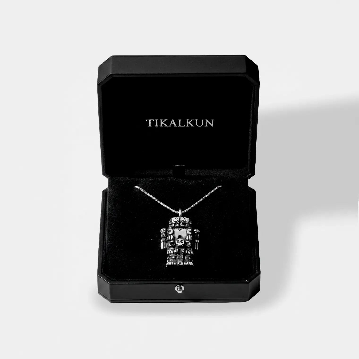 Coatlicue silver necklace inside a leather TIKALKUN jewelry box