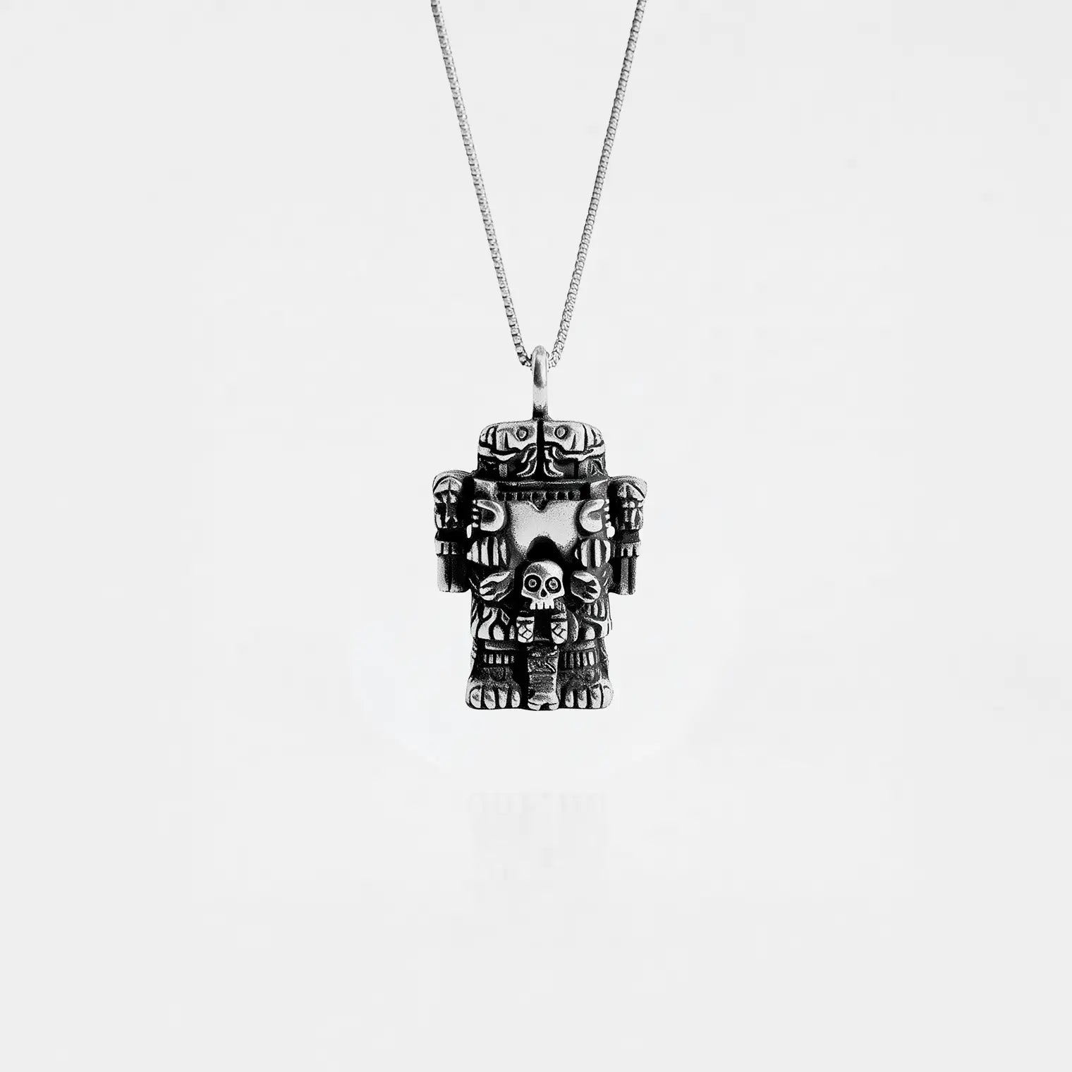 COATLICUE SILVER NECKLACE ON A WHITE BACKGROUND