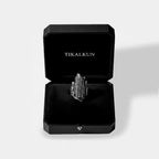 Silver corn ring in a black Tikalkun jewelry box on a light gray background