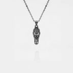Silver crocodile pendant necklace on a white background