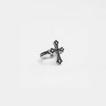 Silver cross ring with gemstone on a white background