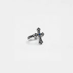 Silver cross ring with gemstone on a white background