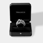 Silver elephant ring in a black Tikalkun jewelry box on a light gray background