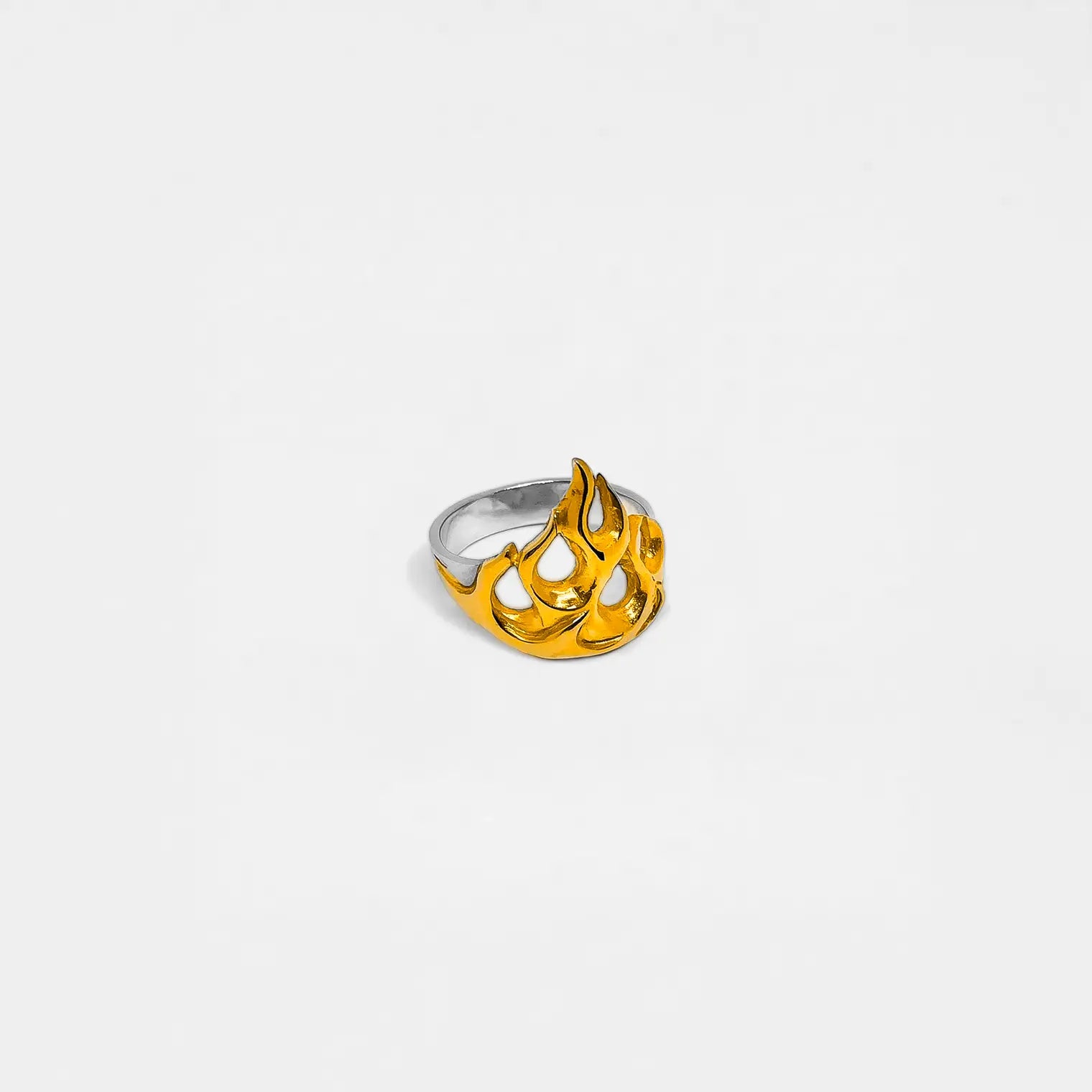 Gold and silver fire-flame ring on a white background