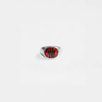 Silver ring with an opal fire stone on a white background