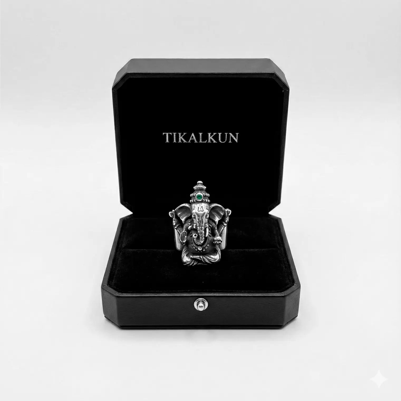 Silver ganesha ring in a black Tikalkun box on a white background