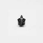 Black ring with a ganesha design on a white background