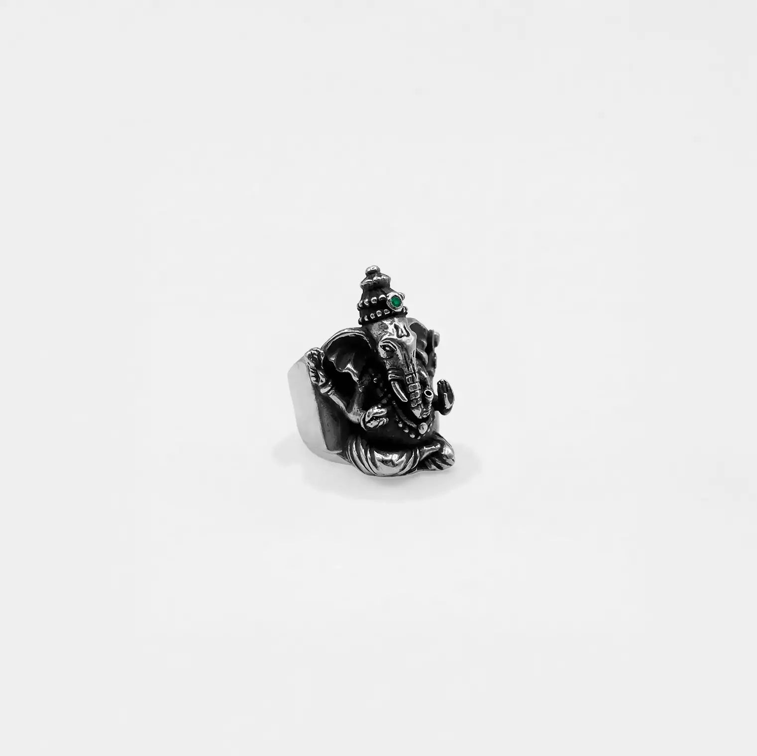 Silver ganesha ring against a white background