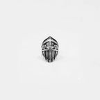 Silver knight's helmet ring on a white background