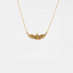 Gold necklace with an egyptian pendant on a white background