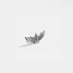 Silver isis figurine on a white background