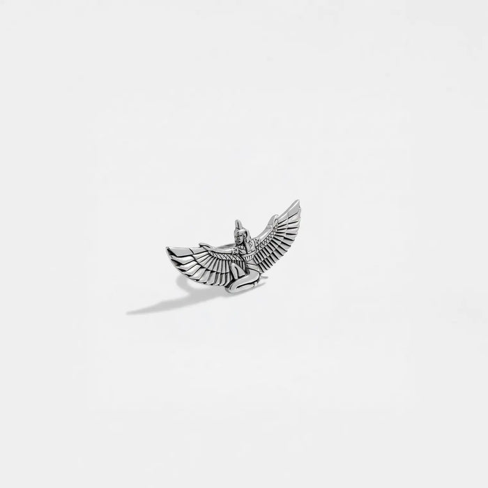 Silver isis figurine on a white background