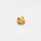 Gold ring with a jaguar head design on a light gray background