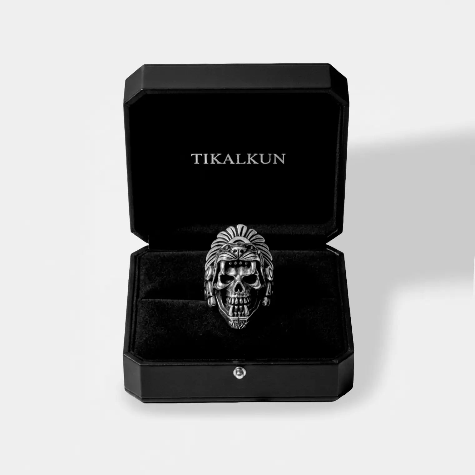  jaguar-warrior Skull ring in a black Tikalkun box on a light gray background