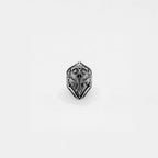 Silver knight's helmet ring on a white background