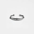 Silver bracelet on a light gray background