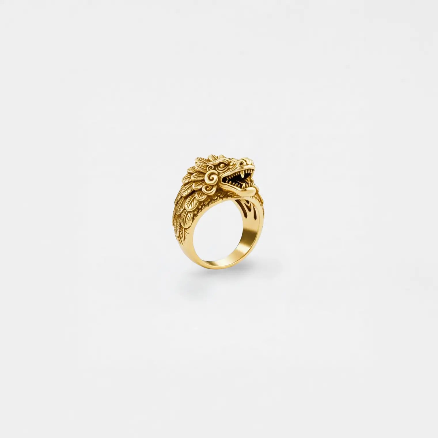Kukulkan gold ring on a white background
