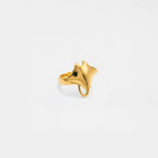 Gold ring shaped like a stingray on a light gray background