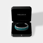 Turquoise bracelet in a black Tikalkun box on a white background