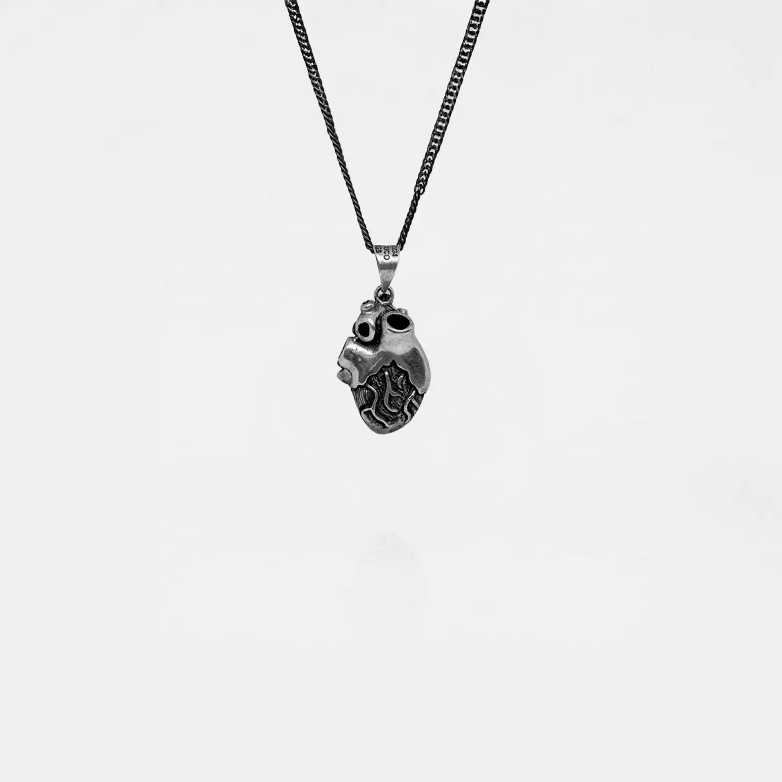 Silver HEART  pendant necklace on a white background