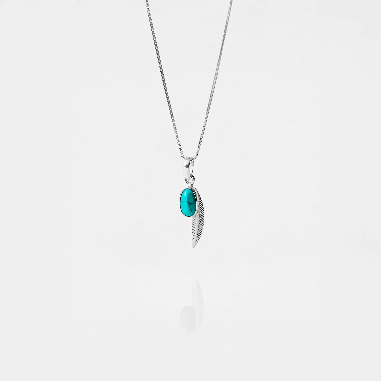 Feather Necklace with a turquoise pendant on a white background