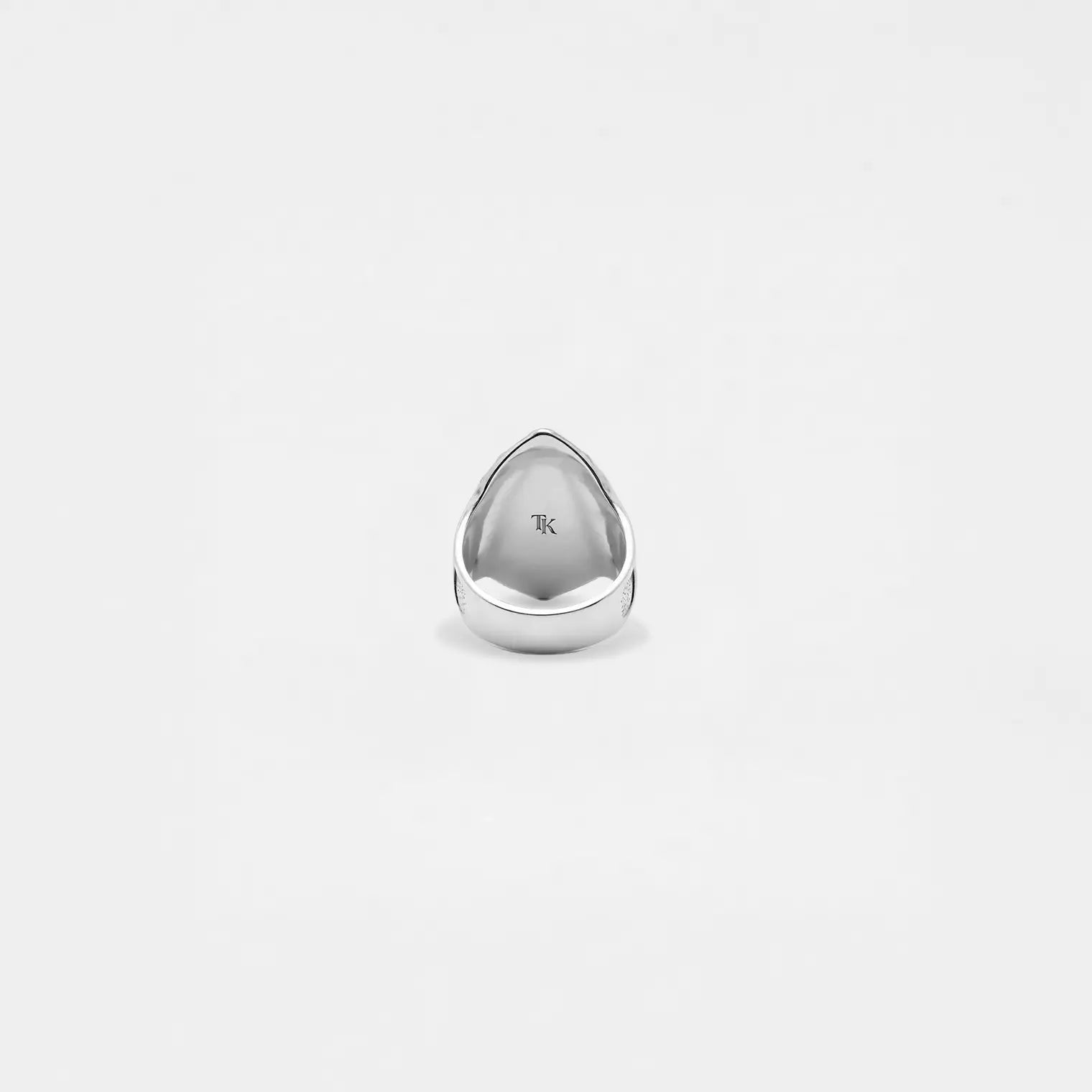 Silver medieval shield ring on a white background
