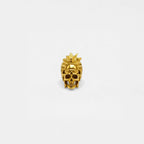 Gold skull wearing a headdress ring on a white background