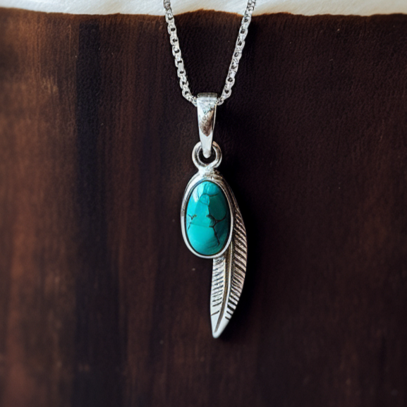 turquoise with a feather silver pendant