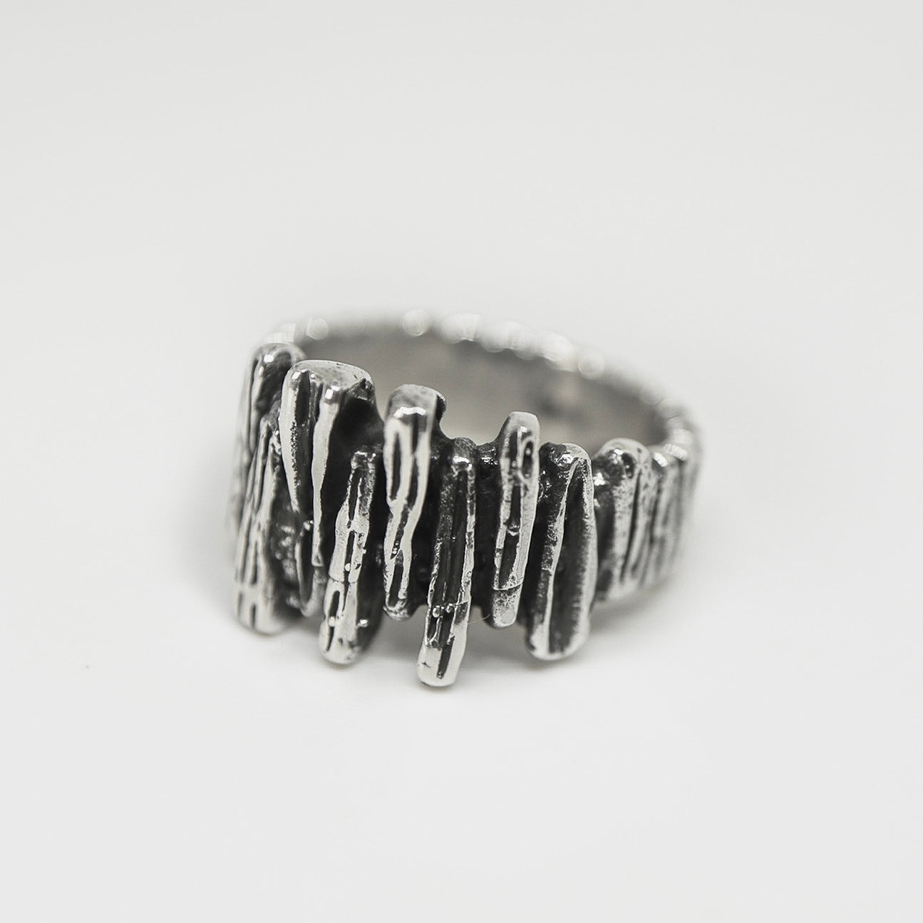 Silver ring shaped like a rock wall