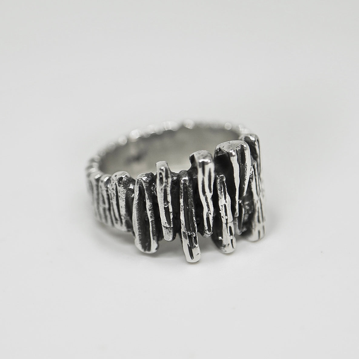 Silver ring shaped like a rock wall