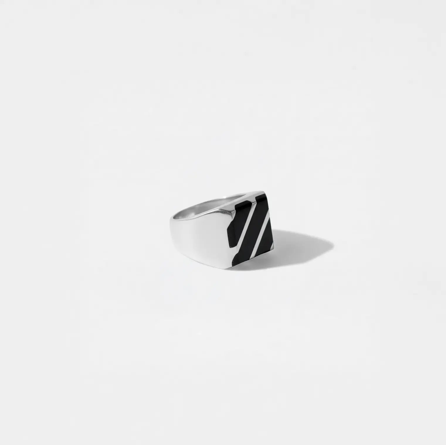 Silver ring with OBSIDIAN STRIPES  design on a light gray background