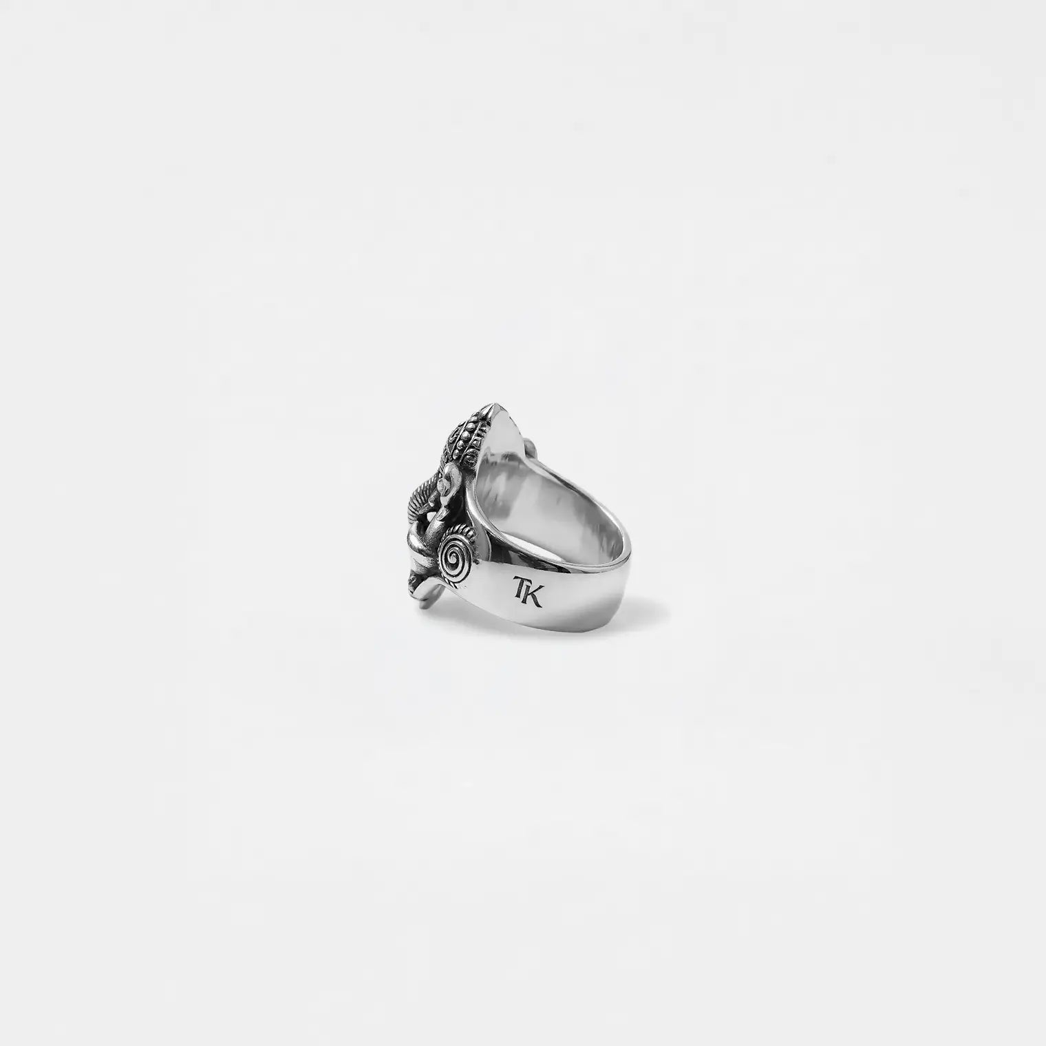 Silver ganesha ring on a white background