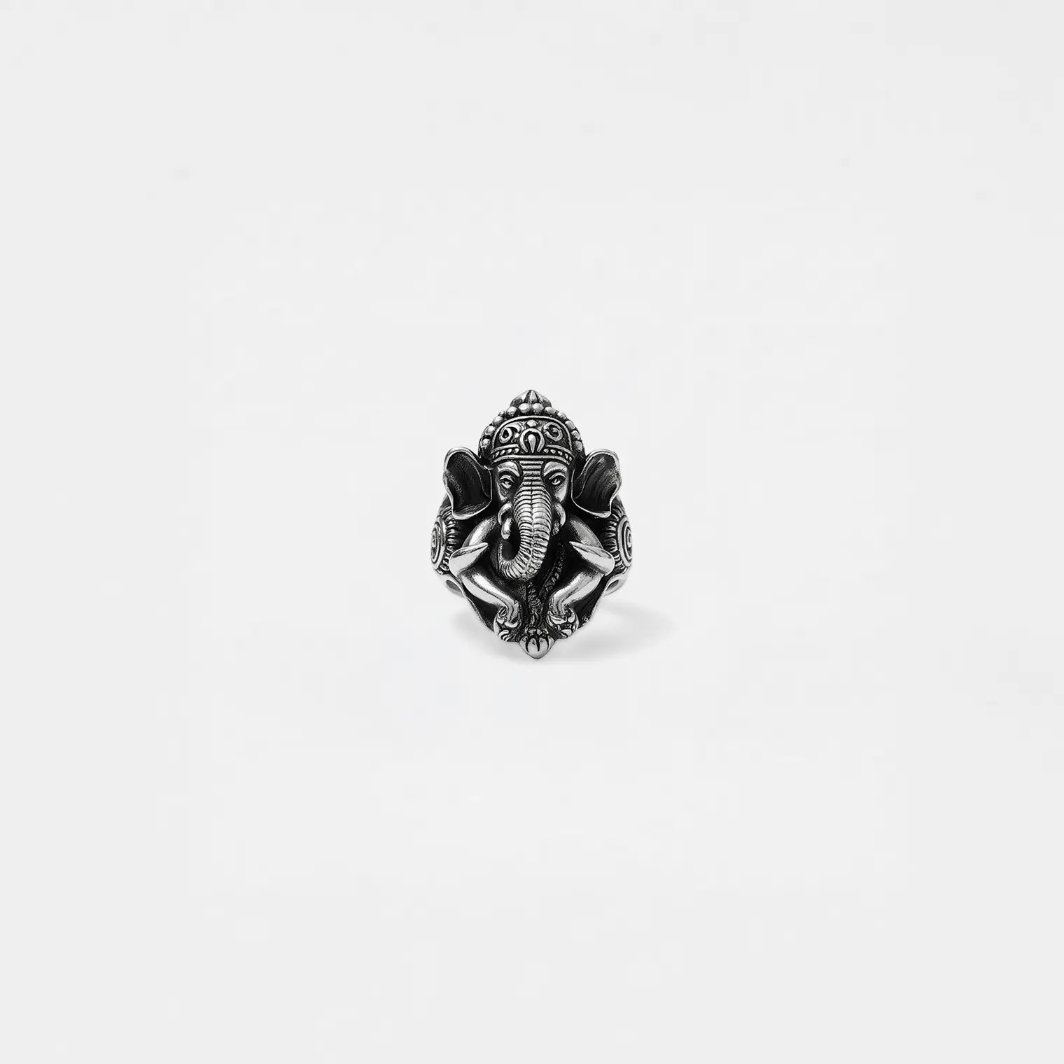 Silver elephant head ring on a white background